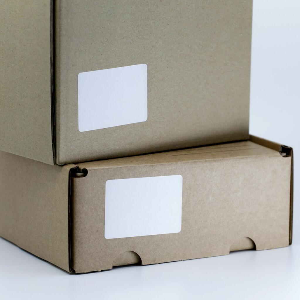 Brown cardboard shipping box on white table representing ecommerce delivery