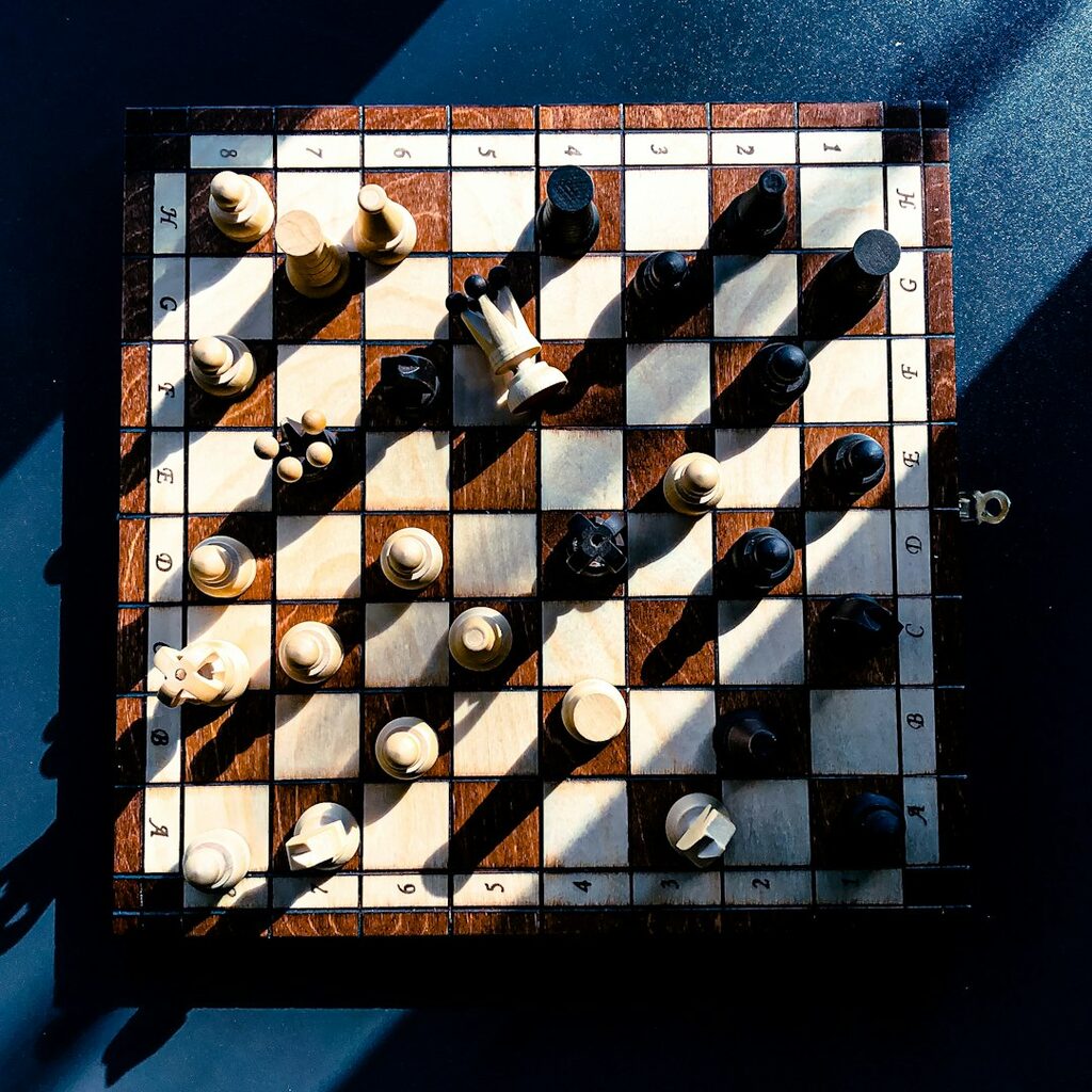 Chess piece fallen representing startup failure lessons in Algeria