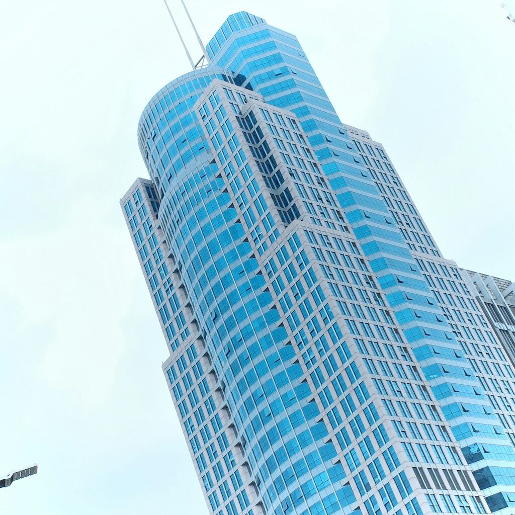 Modern glass skyscraper representing Algeria stock exchange opening to startups